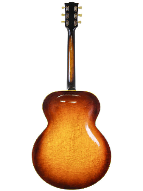 The Gibson ES-335 in a beautiful sunburst finish, a vintage gem from 1946, representing American guitar excellence.
