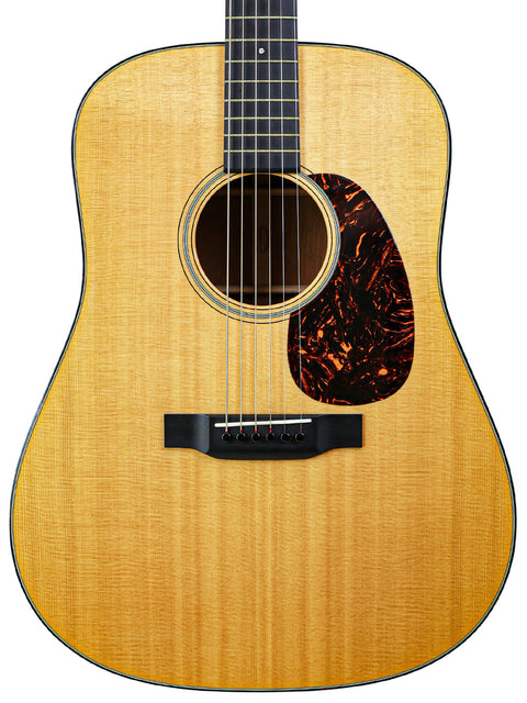 The Taylor D-30 acoustic guitar, featuring a beautiful wood grain and classic design, ideal for both beginners and pros.