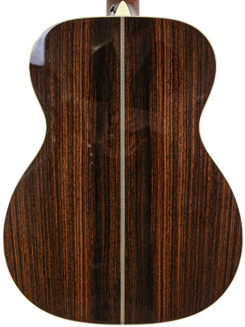 The back of a 2006 Martin 000-28EC Eric Clapton Signature guitar, featuring a smooth, dark brown wood surface.