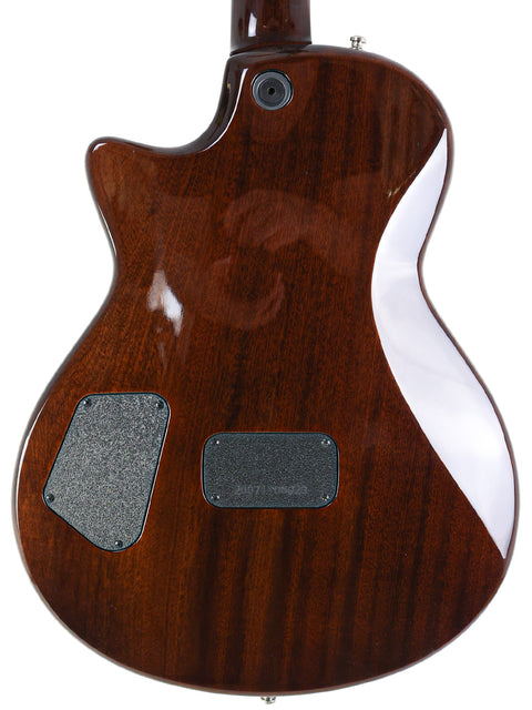 The back of a 2007 Taylor Solid Body electric guitar, highlighting its sleek wooden body and quality USA design.
