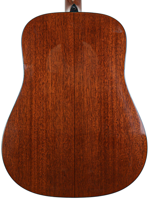 The back of a 2012 Martin D-18 acoustic guitar, featuring a warm brown finish that highlights its classic design.