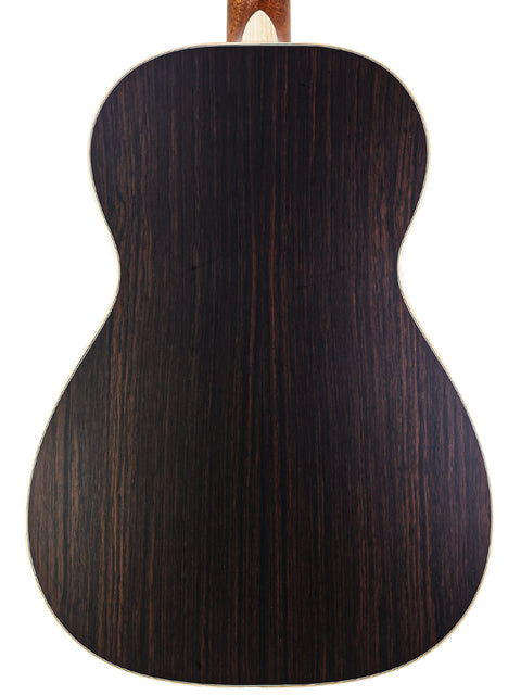 The back of a Larrivée 0-40R acoustic guitar, featuring a beautifully crafted wooden back, made in the USA in 2016.