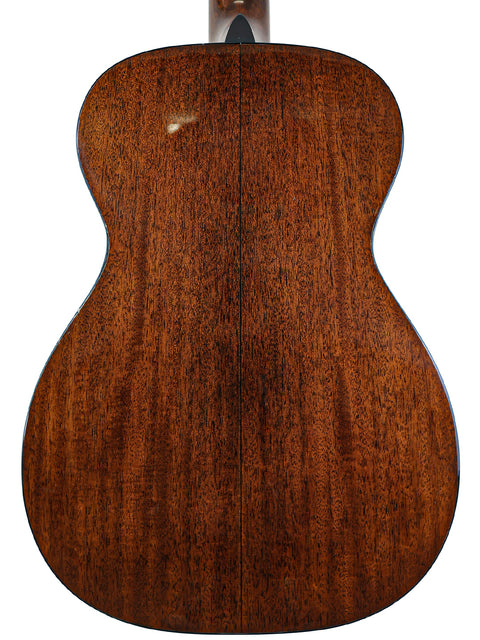The back of a Martin 0-18 acoustic guitar, highlighting its rich wood grain and design, made in the USA in 2021.