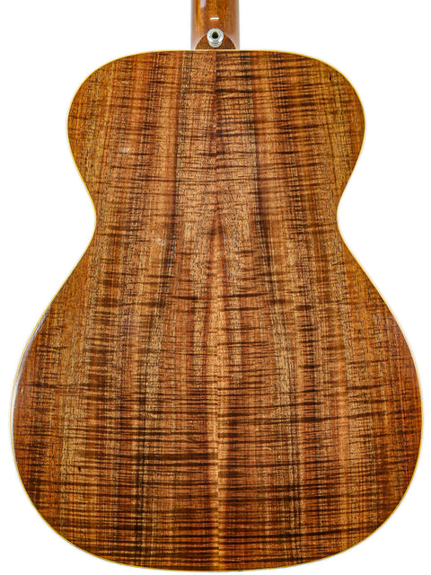 The back of a Matchless Lightning 15 Combo acoustic guitar, showcasing its beautiful wooden back from 1997, USA.