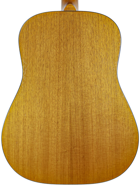 The back of a Maton M225 acoustic guitar, made in Australia in 1996, emphasizing its stunning wood details and craftsmanship.