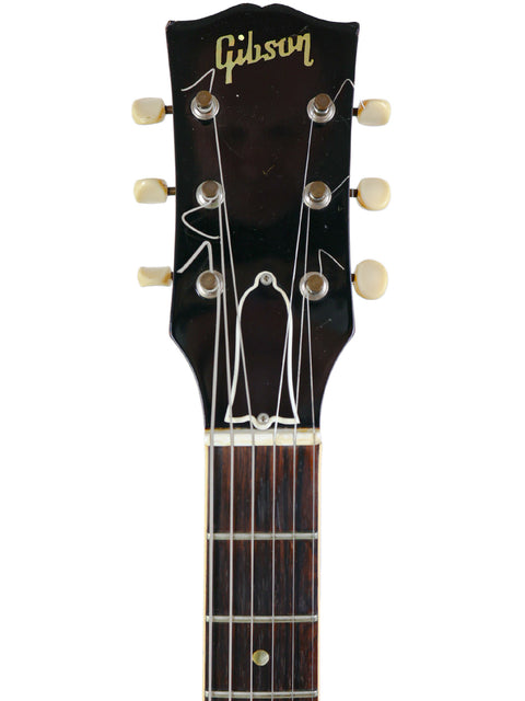 The headstock of a 1964/5 Vintage Gibson SG Special, exemplifying the renowned quality of Gibson guitars.