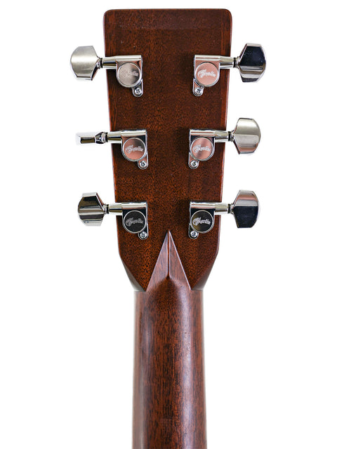 The neck of a Martin HD-28 acoustic guitar from 2006, featuring smooth wood grain and well-defined frets.