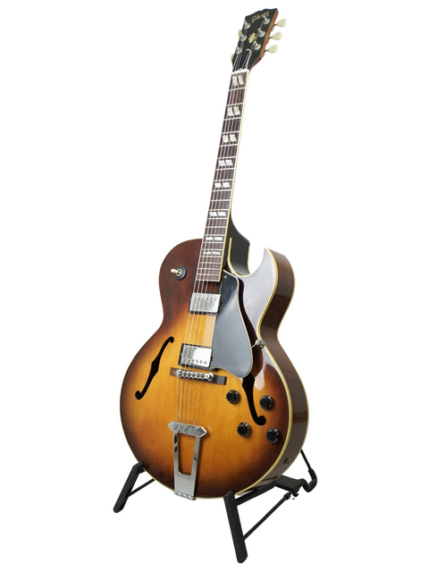 The vintage 1986 Gibson ES-175 guitar stands proudly on a stand, a testament to timeless musical artistry.