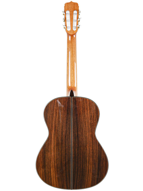 The wooden back of a José Ramírez Estudio 3 acoustic guitar, highlighting its craftsmanship and design from Spain, 2019.
