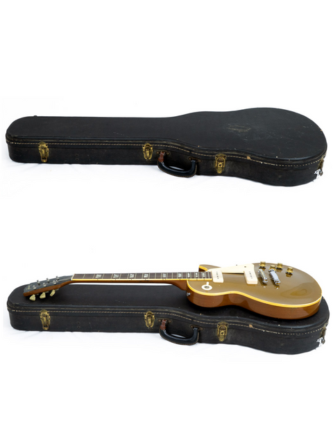 Two gold-bodied Gibson Les Paul guitars from 1968, displayed in stylish black cases, representing timeless craftsmanship.