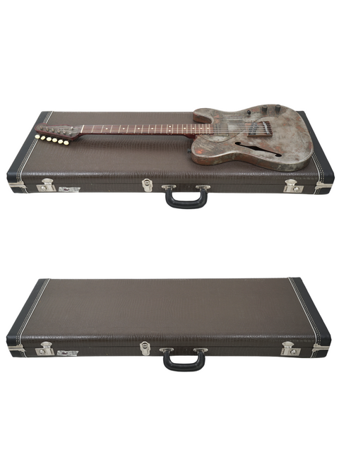 Two guitar cases are shown, one holding a guitar inside while a James Trussart Steelcaster rests on top.
