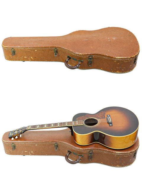 Two guitars featured: a vintage 1952 Gibson J-185 secured in a case and another guitar placed beside it uncovered.