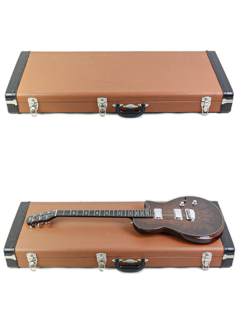 Two guitars in a case on a white background, including a 2007 Taylor Solid Body made in the USA.