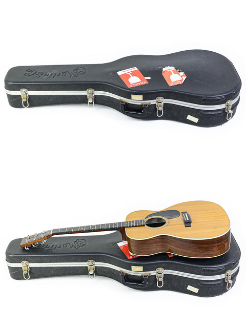 Two guitars positioned differently, highlighting a vintage Martin 000-28 from the USA, crafted in 1976.
