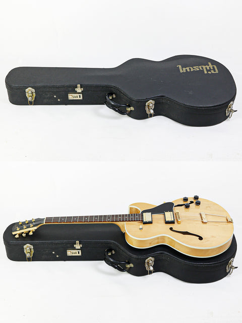 Two guitars with cases on a white background, featuring a Gibson ES-135 from the USA, year 2002.
