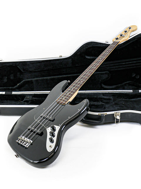 USA 2005 Fender Jazz Bass guitar in a protective case, displayed on a white background.