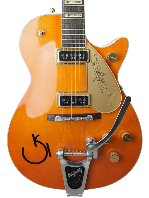 Unique Gretsch Roundup 6121W Reissue guitar with vibrant orange body and signature, a must-have for serious guitar collectors.