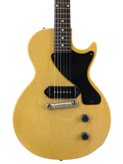 Vintage 1956 Gibson Les Paul Jr guitar, colored TV Yellow with a contrasting black pick guard, exemplifying classic style.