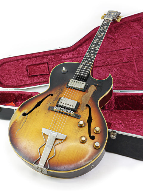 Vintage 1962 Gibson ES-175D guitar in a case, featuring another case on top for added protection.