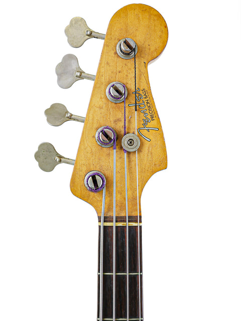 Vintage 1963 Fender L-Series Precision Bass guitar in close-up, highlighted by a simple white background.