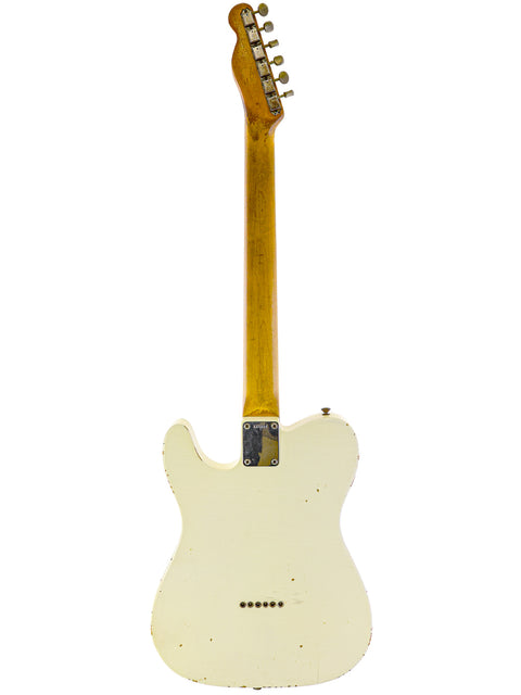  Vintage 1963 Fender Telecaster guitar in white, highlighting its wooden body and neck, a classic piece of musical history.