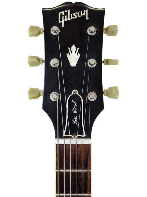 Vintage 1964 Gibson Les Paul Custom, featuring a sleek body and elegant details, ideal for collectors and musicians alike.