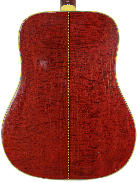 Vintage 1968 Gibson Dove acoustic guitar viewed from the back, highlighting its red finish.