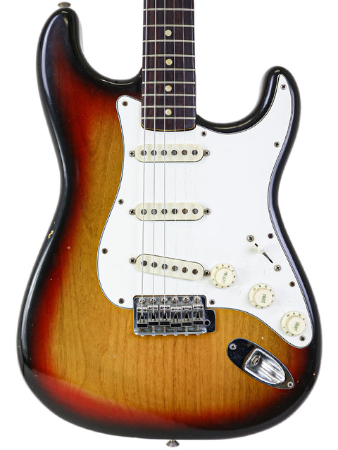 Vintage 1974 Fender Custom Shop Stratocaster in sunburst finish, showcasing classic design and craftsmanship.