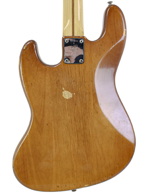 Vintage 1974 Fender Jazz Bass, showcasing a sleek wooden body that embodies the essence of classic electric guitars.