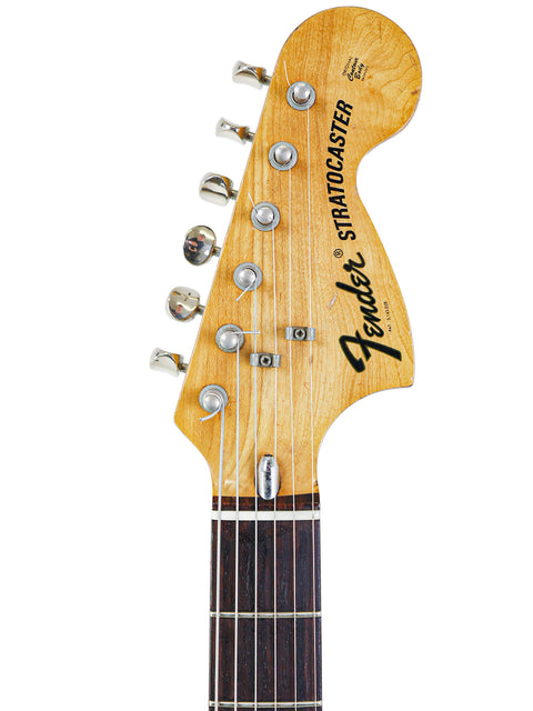 Vintage 1974 Fender Stratocaster guitar with the Fender logo, exemplifying classic American craftsmanship.