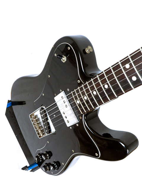 Vintage 1978 Fender Telecaster Custom in black, equipped with a blue pickup and a luxurious rosewood fingerboard.