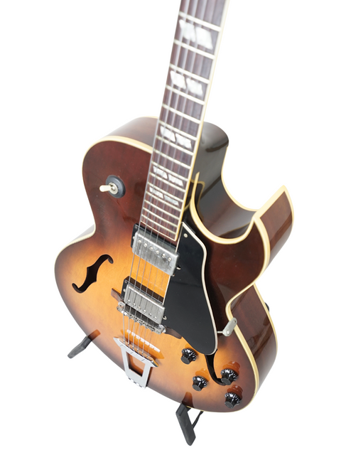 Vintage 1986 Gibson ES-175 guitar with a stunning brown body and elegant black pick guard, crafted in the USA.
