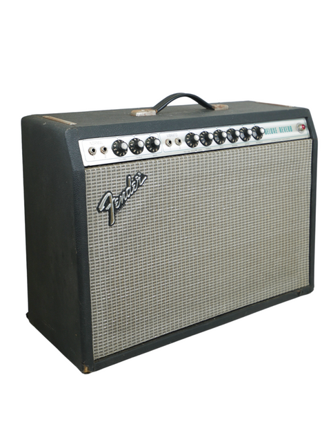 Vintage Fender Deluxe Reverb Silverface Combo amp from 1979 next to a Stratocaster guitar, ideal for classic rock enthusiasts.
