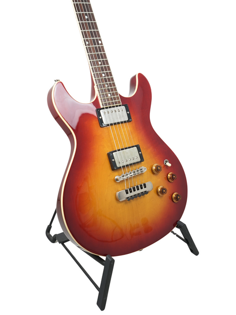 Vintage Fender Esprit from 1984, featuring a beautiful sunburst finish, displayed on a stand for all to admire.