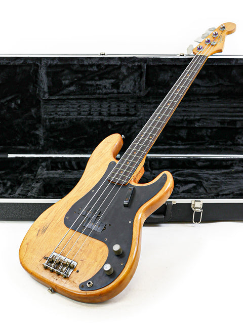 Vintage Fender L-Series Precision Bass from 1963, resting in its case on a plain white surface.