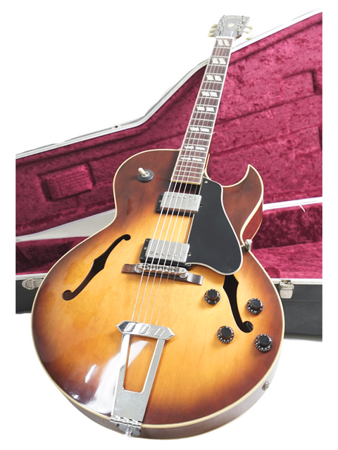 Vintage Gibson ES-175 guitar from 1986 resting in its case, a perfect blend of style and musical history.