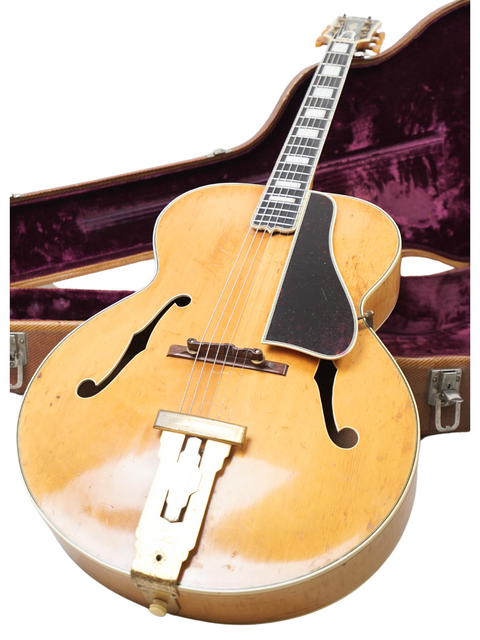 Vintage Gibson L-5 guitar from 1939, neatly placed in its case on a white surface.