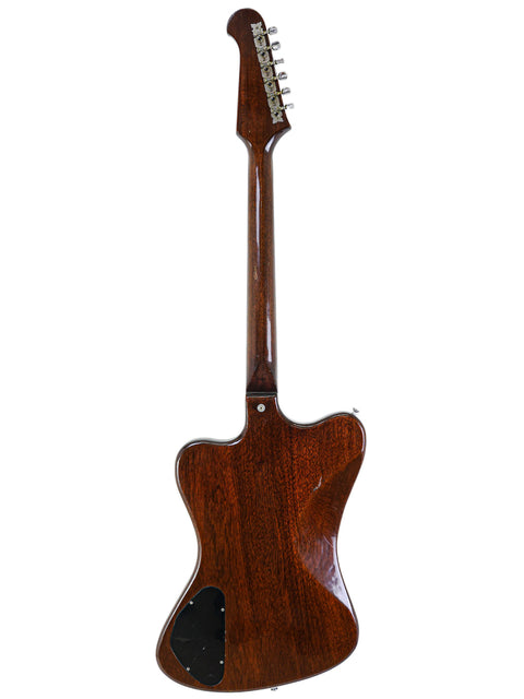 Vintage Gibson Non Reverse Firebird III guitar from 1966, characterized by its wooden body and neck, a true classic.