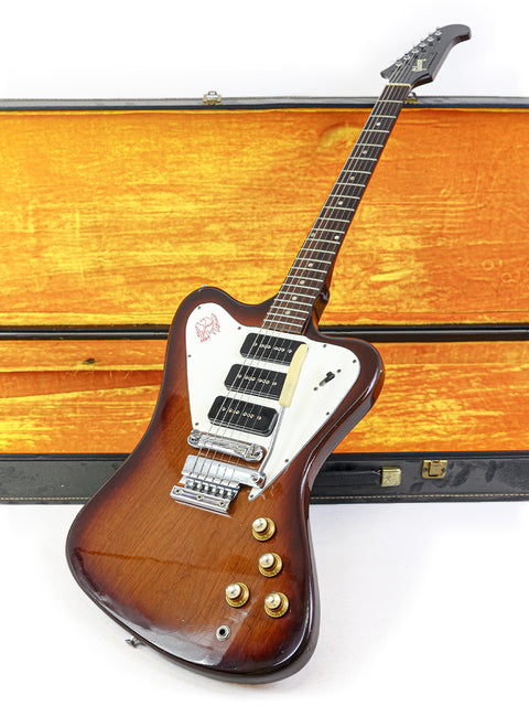 Vintage Gibson Non Reverse Firebird III guitar from 1966, elegantly resting in a wooden case, emphasizing its timeless style.