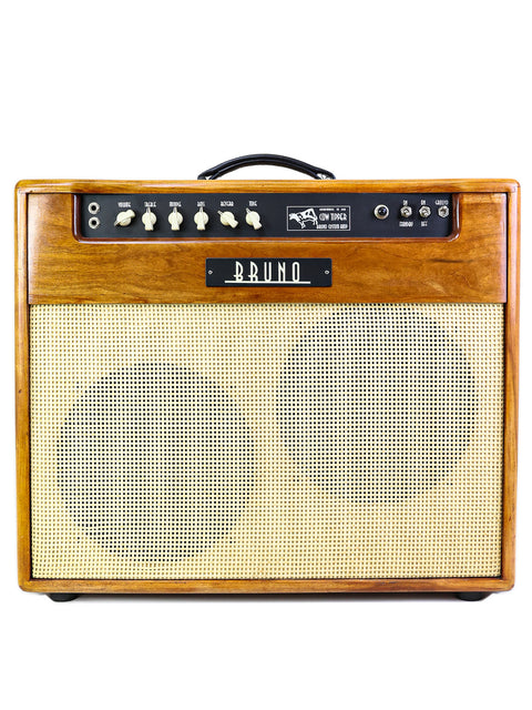 Vintage wooden Bruno guitar amplifier with control knobs and a beige speaker grill.