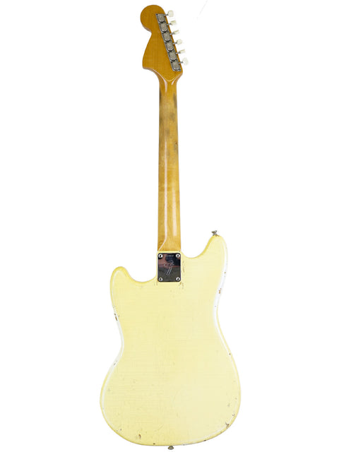White 1967 Fender Mustang guitar with a wooden body and neck, embodying the essence of vintage American rock.