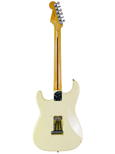 White electric guitar, Fender Jeff Beck Signature Stratocaster 2015, featuring a beautifully crafted wooden body.
