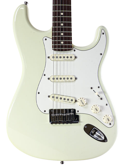 White electric guitar featuring a black pickguard, identified as a 2008 Fender Custom Shop Jeff Beck Signature Stratocaster.
