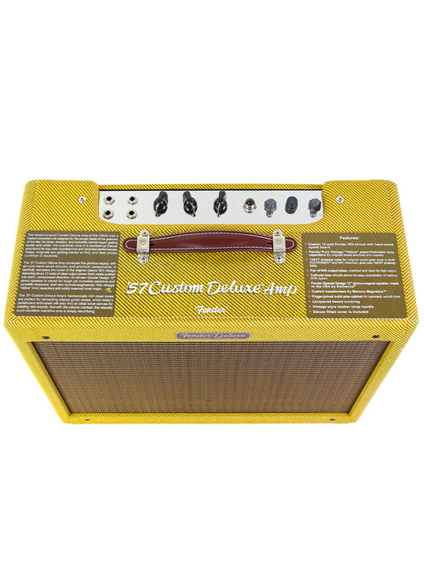 Yellow Fender '57 Custom Deluxe Amp with brown handle and control knobs on top.