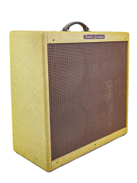 Yellow Fender Bassman guitar amplifier on a white background.