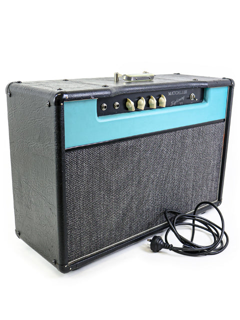 blue and black Matchless Lightning 15 Combo amplifier from 1997, featuring a power cord attached to its side.
