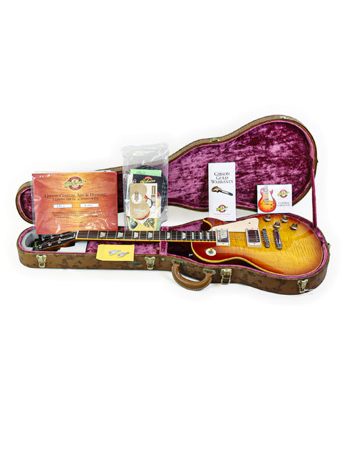 guitar case containing a Gibson Custom Shop 1959 Reissue Les Paul R9, highlighting its iconic shape and vintage appeal.
