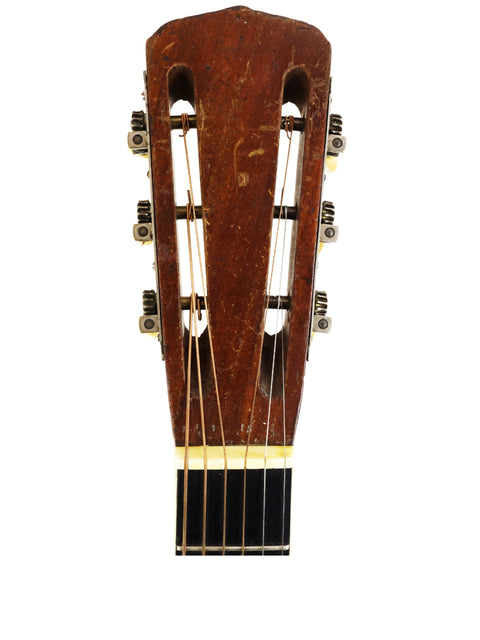 1940s Martin D-18E acoustic guitar, featuring a beautiful wood grain and elegant craftsmanship, ideal for collectors.