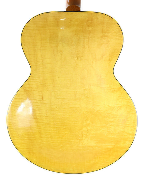 1952 vintage Gibson ES-300 guitar in yellow, with a rich wooden back, exemplifying timeless musical artistry.