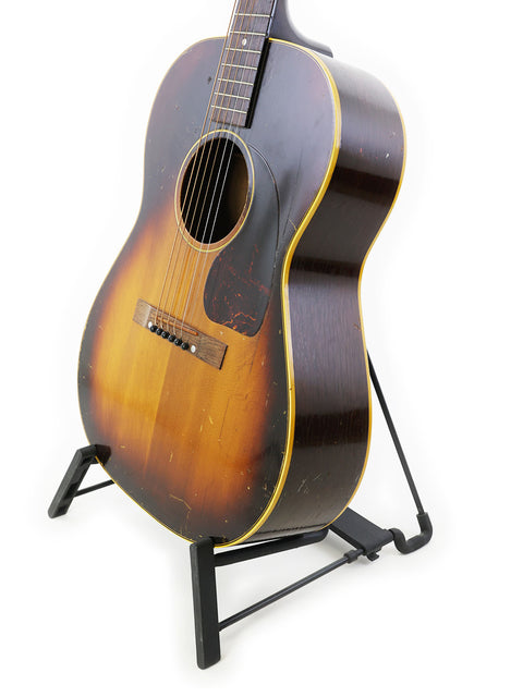 1954 Gibson LG-2 acoustic guitar, a vintage model from the 1940s, known for its beautiful sound and craftsmanship.